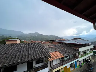 a view of roofs of buildings in a town at Apartamentos Primavera in Jardin
