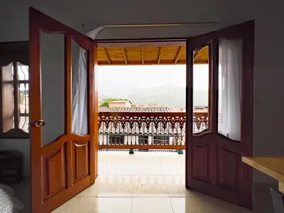 an open door with a view of a balcony at Apartamentos Primavera in Jardin