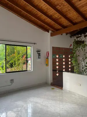 a room with a large window and a white wall at Hospedaje la Glorieta in Santa Fe de Antioquia
