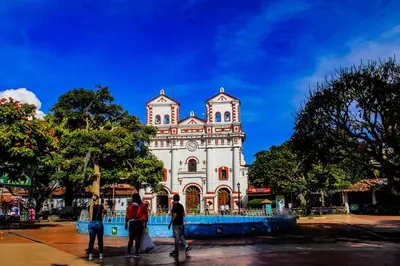 a group of people standing in front of a building at Hotel Real Guatapé in Guatapé