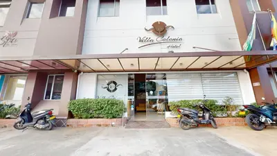 a group of motorcycles parked outside of a building at Hotel Villa Colonia in Marinilla
