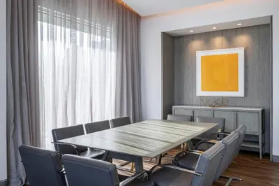 a dining room with a table and chairs at Medellin Marriott Hotel in Medellín