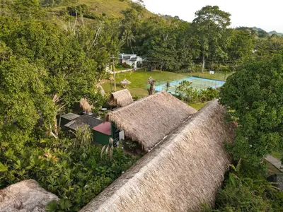an aerial view of a resort with a swimming pool at Los Colores Ecoparque in Doradal