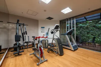 a gym with several treadmills and exercise bikes at Hotel Estelar Blue in Medellín