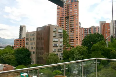 a view of a city with tall buildings at Hotel Madeiro in Medellín