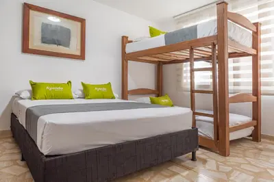 a bedroom with a bunk bed and a ladder at Hotel Boutique Laureles Home - Ayenda 1258 in Medellín