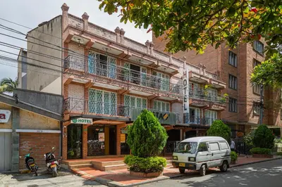 a small car parked in front of a building at Hotel Boutique Laureles Home - Ayenda 1258 in Medellín