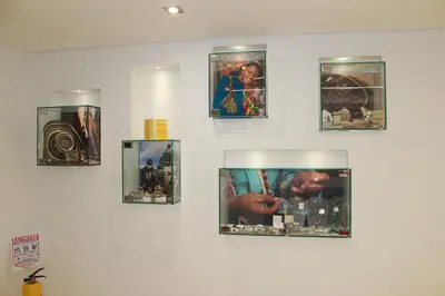 a wall with four pictures on a wall at Obo Hotel in Medellín
