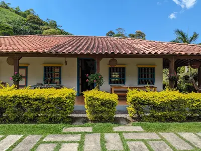 a house with a bench in front of it at Patio Bonito in Jardin