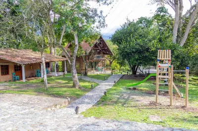 a playground in front of a house with a ladder at Portón de Occidente by Bernalo Hotels in San Jerónimo