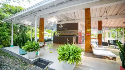 a pavilion with potted plants in a building at Portón de Occidente by Bernalo Hotels in San Jerónimo