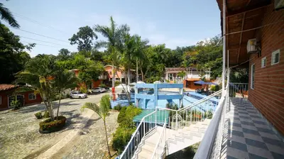 a balcony of a house with a swimming pool at Portón de Occidente by Bernalo Hotels in San Jerónimo