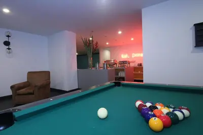 a room with a pool table with balls on it at Pop Art Hotel Las Colinas Manizales in Manizales
