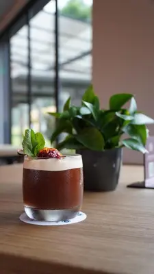 a small dessert on a table with a plant at Hotel Estelar El Cable in Manizales