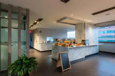 a kitchen with a counter with fruit on it at Hotel Holiday Inn Express & Suites Medellin by IHG in Medellín