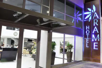 an entrance to a building with a sign on it at Arame Hotel in Envigado