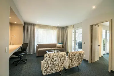 a hotel room with a couch and a desk at Four Points by Sheraton Medellín in Medellín