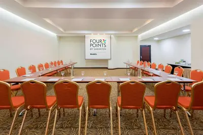 a conference room with a long table and chairs at Four Points by Sheraton Medellín in Medellín