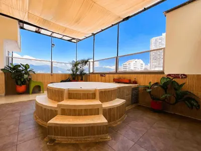 a large room with a table and some windows at Hotel Florencia Plaza in Medellín