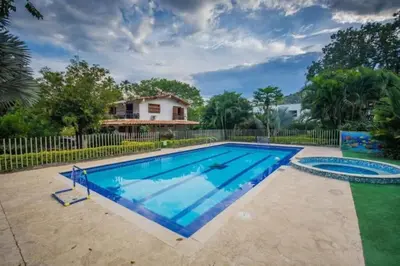 a swimming pool in front of a house at Hotel San Sebastian del Tonusco in Santa Fe de Antioquia