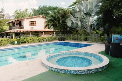 a swimming pool in front of a house at Hotel San Sebastian del Tonusco in Santa Fe de Antioquia