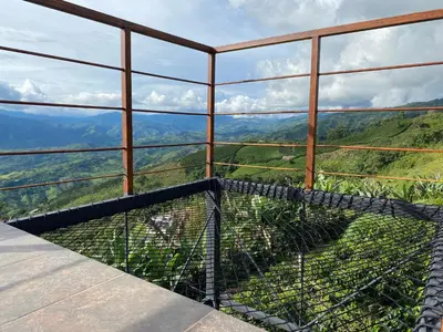 a view from the top of a lookout in the mountains at Finca Hotel Los Guayacanes in San JosÃ©
