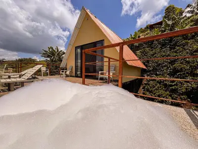 a pile of snow in front of a house at Finca Hotel Los Guayacanes in San JosÃ©