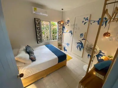 a bedroom with a bed and a window at Hotel Casa de Verano - Solo adultos - in Santa Fe de Antioquia