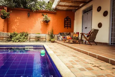 a swimming pool in the backyard of a house at Hotel Casa de Verano - Solo adultos - in Santa Fe de Antioquia