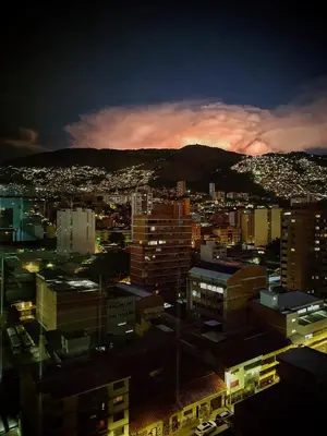 a view of a city skyline at night at Gran Hotel in Medellín