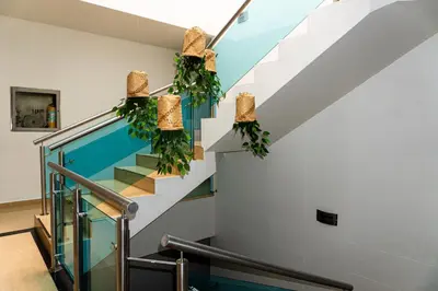 a staircase in a house with wreaths at Hotel Central Plaza Medellin in Medellín