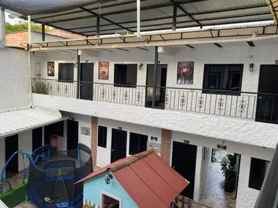 an aerial view of a building with a playground at Hotel Ozzy in Doradal
