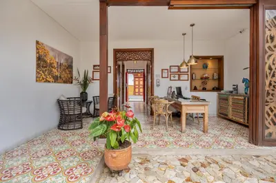 a living room with a table and a dining room at Casa Passiflora Hotel Boutique - Jardín in Jardin