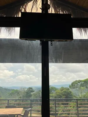 a large window with a view of the jungle at La Manola Finca Hotel in Doradal