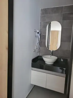 a bathroom with a sink and a mirror at Hotel Piedras De Maní in Manizales