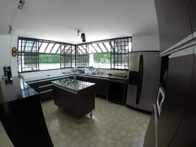 a kitchen with a sink and a refrigerator at Finca Galicia in Sopetran