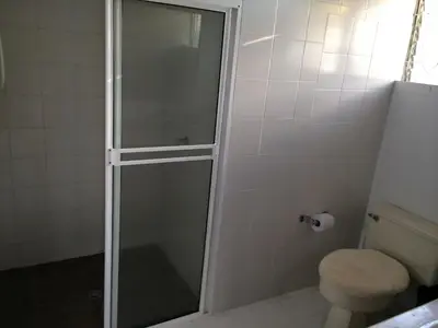 a glass shower in a bathroom with a toilet at Finca La Ranchera No. 1 in Tarso