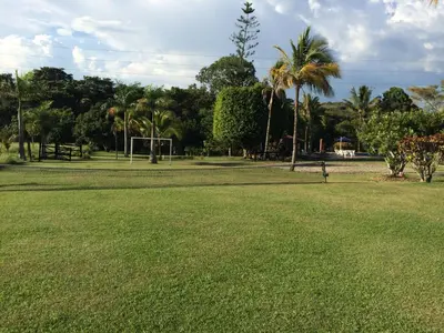 a park with palm trees and a soccer field at Finca La Ranchera No. 1 in Tarso