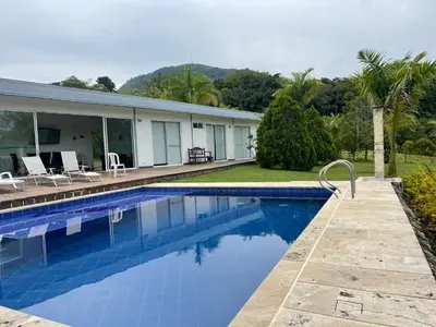 a swimming pool in front of a house at Finca La Ranchera No. 2 in Tarso