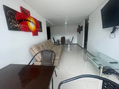 a living room with a couch and a table and a television at Apartamento relajante, amplio, moderno e iluminado, Sabaneta, Medellín , 3 alcobas in Sabaneta