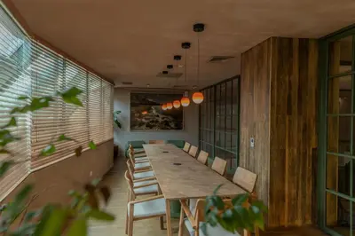 a long dining room with a long table and chairs at The Charlee Hotel in Medellín