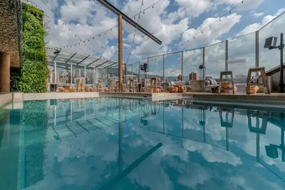 a swimming pool on the roof of a building at The Charlee Hotel in Medellín