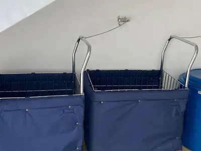 two blue laundry baskets sitting next to a wall at Apartamento en Condominio in San Jerónimo