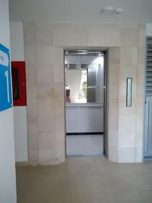 a hallway with a door in a building at Apartamento en Condominio in San Jerónimo