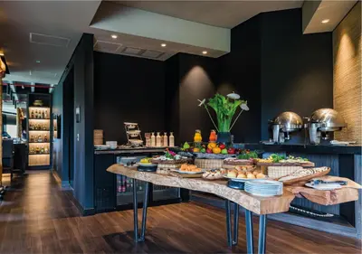 a table with a bunch of food on it at Movich Hotel Las Lomas in Rionegro