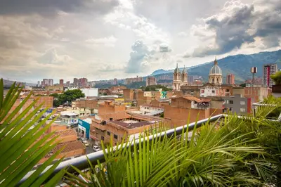 a city view of a city with buildings at Hotel Perlatto in Bello