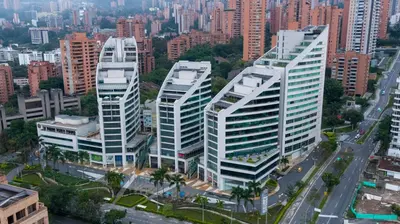 an aerial view of two tall buildings in a city at Hotel San Fernando Plaza in Medellín
