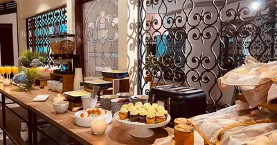 a room with a table with food on it at Hotel Casa Laureles in Medellín