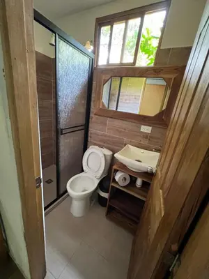 a bathroom with a toilet and a sink at Alojamiento Natural La Cueva de Morgan San Rafael in San Rafael