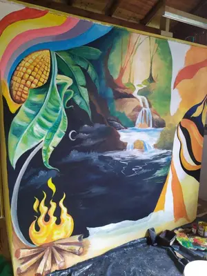 a mural of a waterfall and fire at Alojamiento Natural La Cueva de Morgan San Rafael in San Rafael